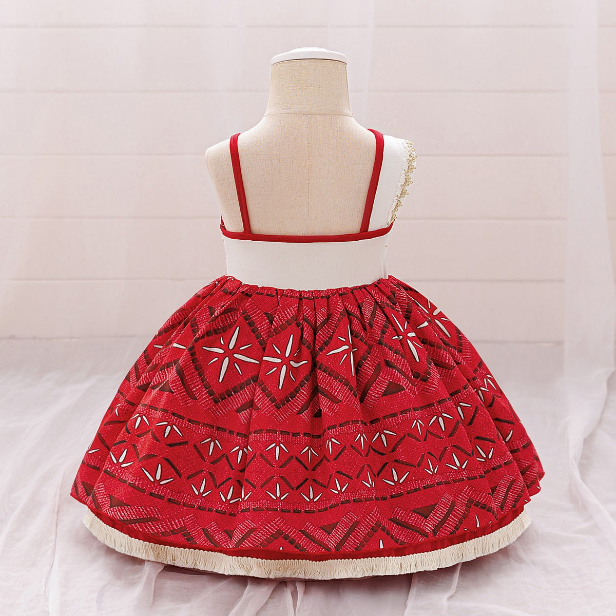 Toddler girls' red princess dress back view showing cream back panel and red straps
