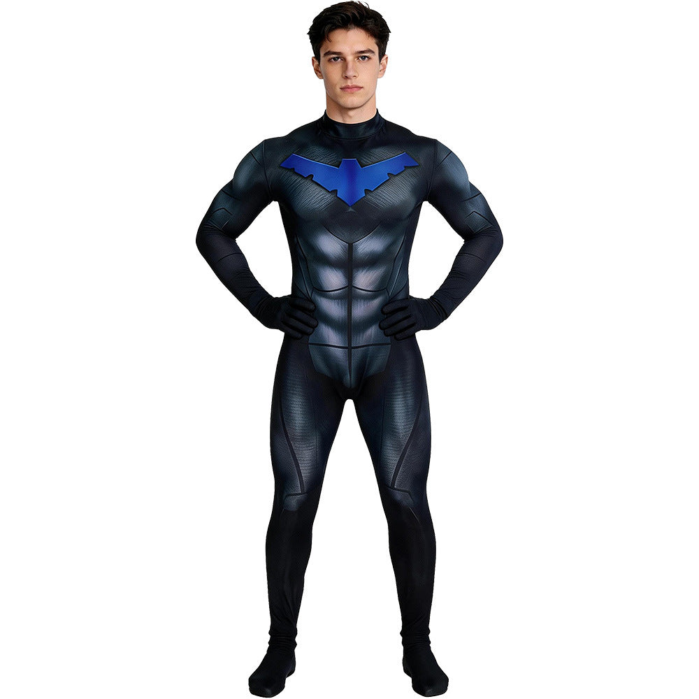 Supplier photo of the black and blue muscle print jumpsuit worn by a model, front view with hands on hips