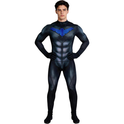 Supplier photo of the black and blue muscle print jumpsuit worn by a model, front view with hands on hips
