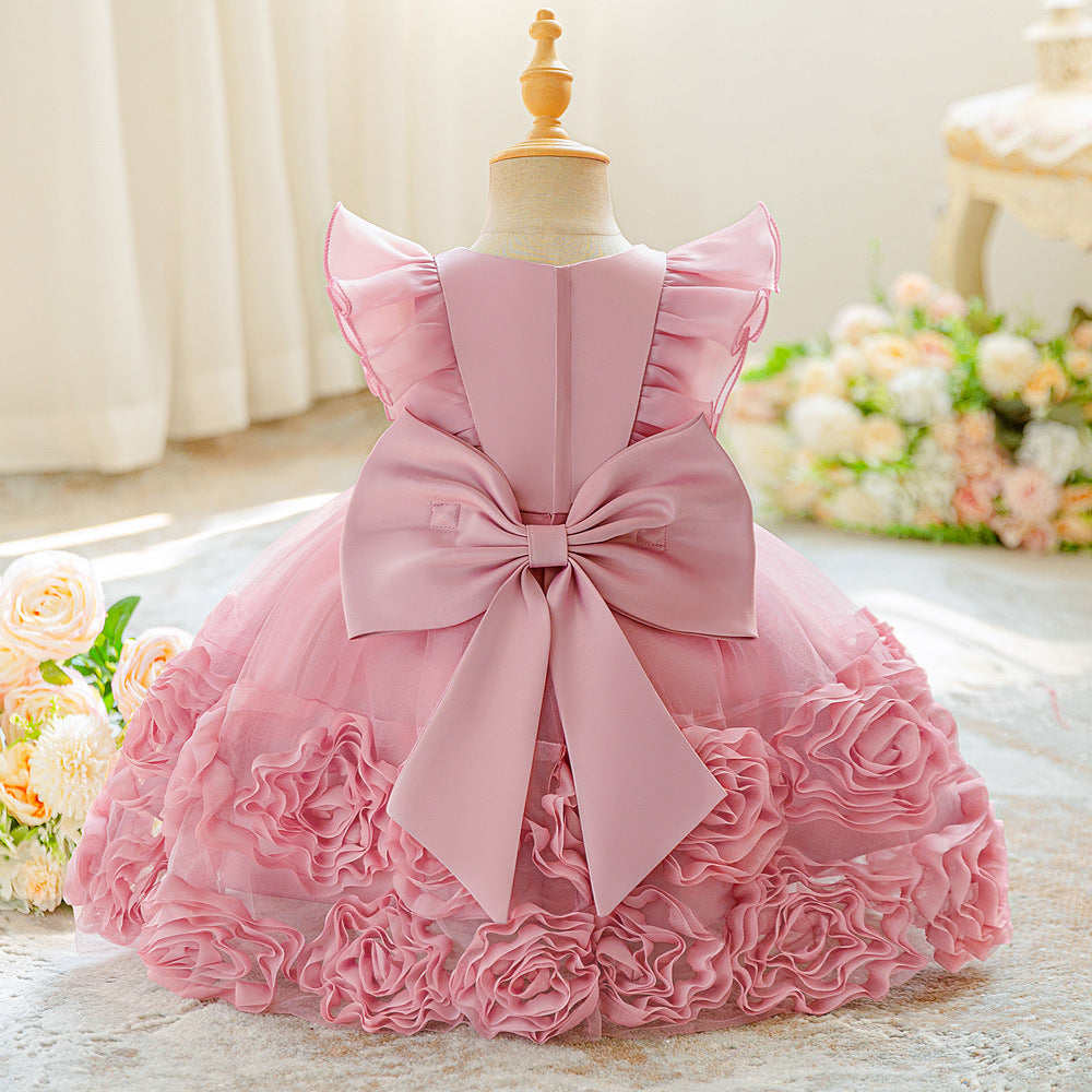 Real product photo of the pink princess dress back: large satin bow, zipper and rose ruffle skirt