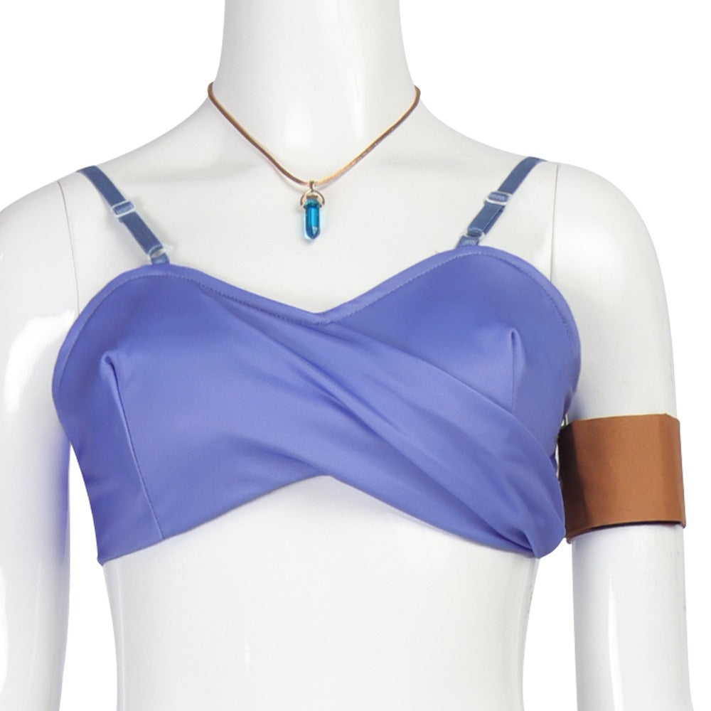 Close-up of the purple twist-front tube top with adjustable straps, blue crystal pendant necklace and brown armband