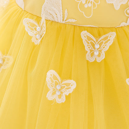 Lace butterfly appliqués with faux pearl centers on the yellow tulle skirt