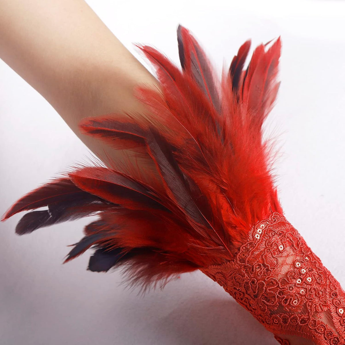 Close-up of the red and black feather cuff attached to the top of the lace glove