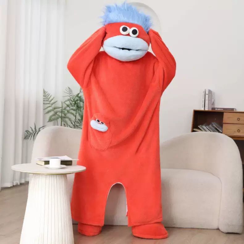 Real photo of the red monster onesie worn with the hood pulled over the head