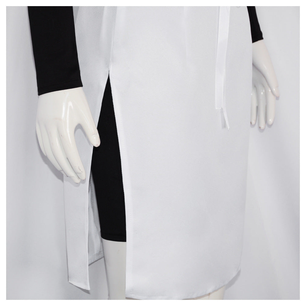 Close-up of the white skirt side slit and front ribbon tie, with the black bodysuit's short legs visible underneath
