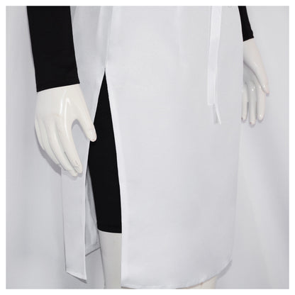 Close-up of the white skirt side slit and front ribbon tie, with the black bodysuit's short legs visible underneath
