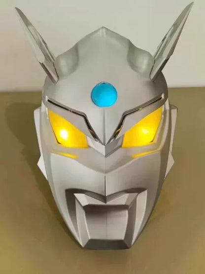 Close-up of the costume's silver light-up helmet with glowing yellow eyes and blue forehead light