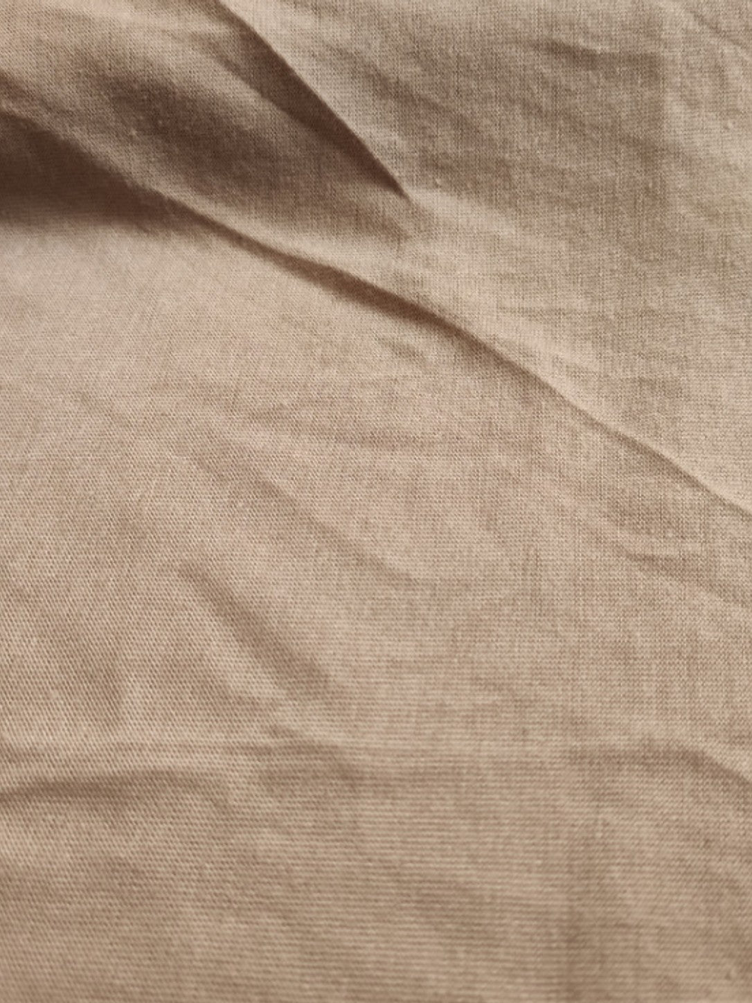 Close-up of the khaki knit fabric used for the short sleeve maxi dress