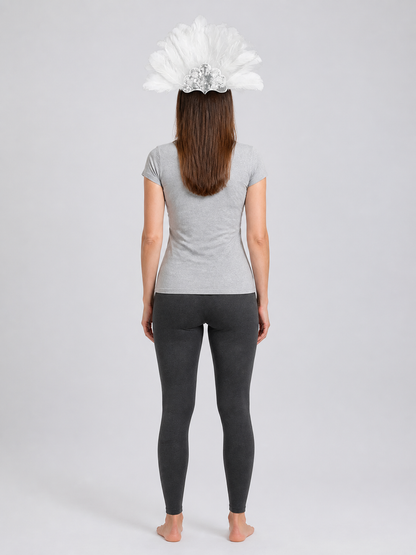 Rear view of a model wearing the white feather headband, showing the feather fan above her gray shirt