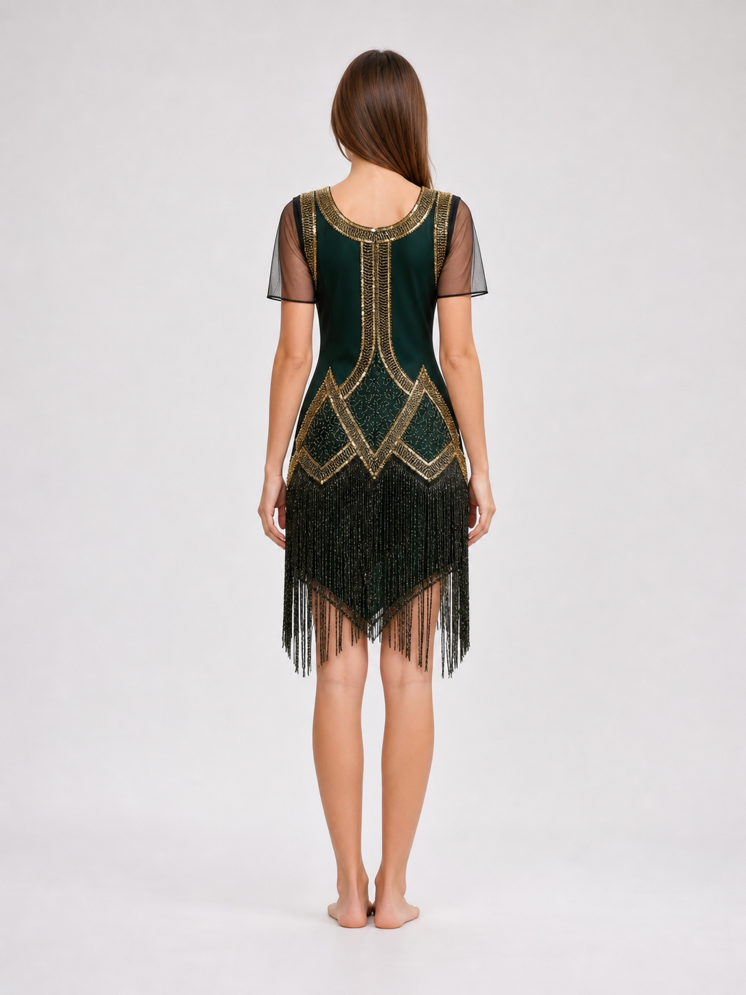 This fringed dress is designed in a vintage cocktail style, combining dark green
