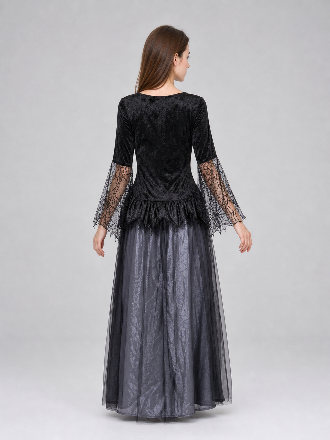 Gothic-style witch costume dress with hat for themed events. The design is mainly black and dark gray, with patterned textured fabric and sheer black accents. The look is centered on a long dress with a fitted lace-up corset, a ruffled neck