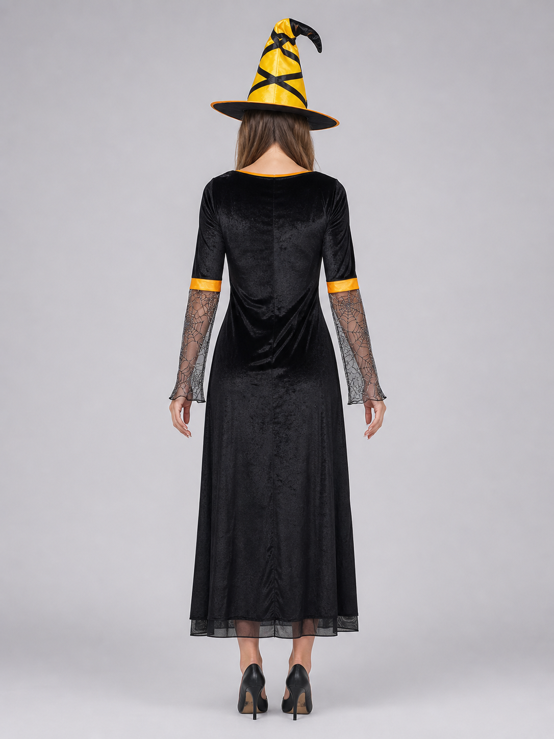 This Halloween costume includes a long dress and a pointed hat. The dress is in a black-and-orange color scheme: the center features a bright orange panel, and the black outer layer has a flared hem. The semi-sheer sleeves are decorated wit