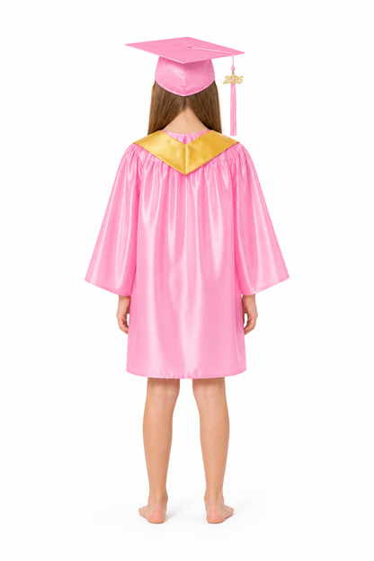 Pink children's graduation gown with cap and cape back view