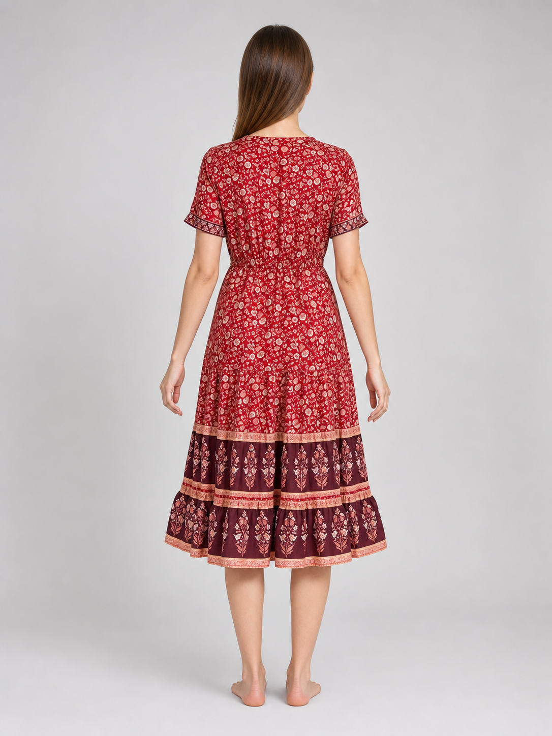 Midi dress with a floral print and tiered skirt