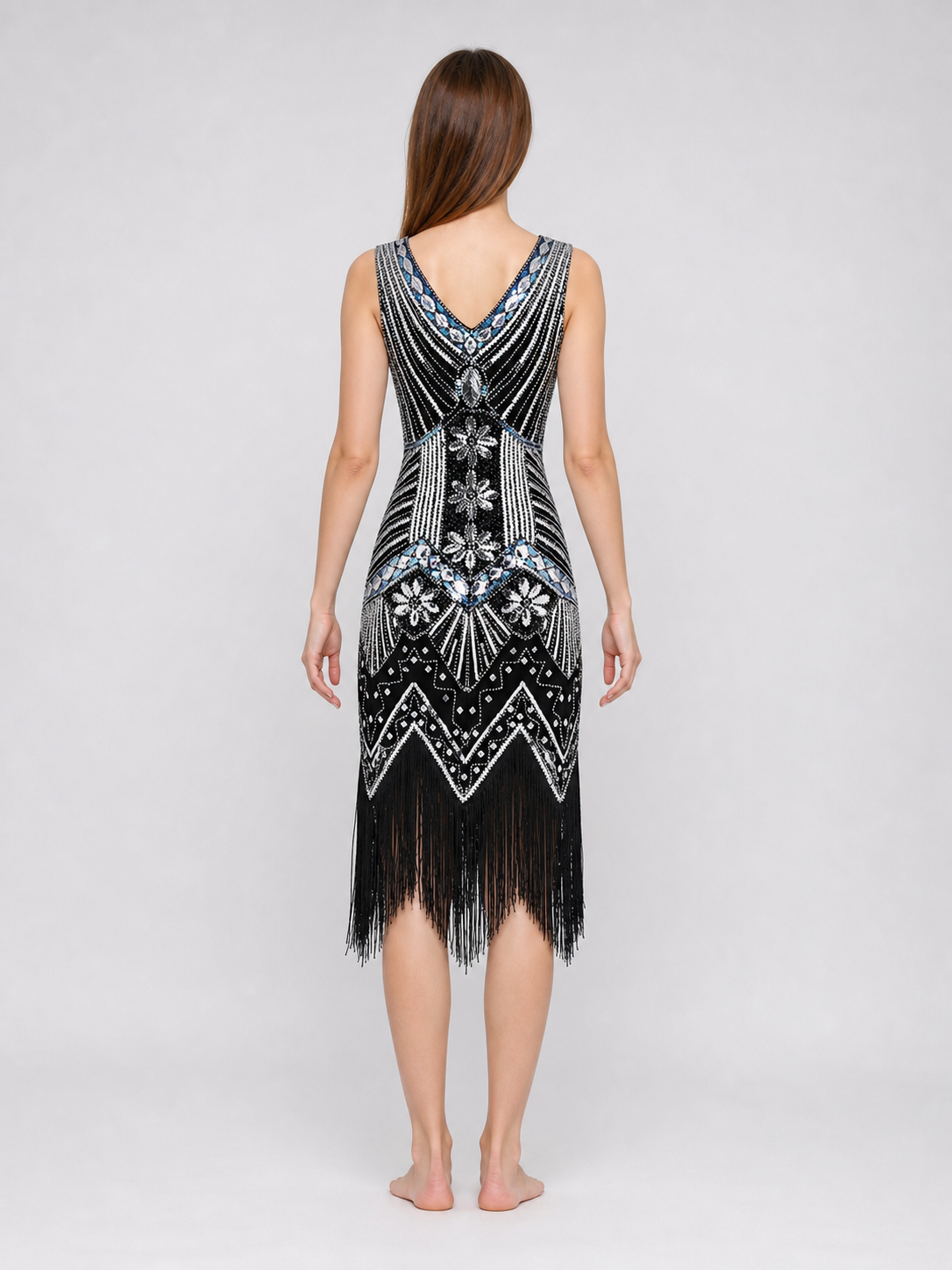 Sleeveless dress with a V-neckline and a fitted silhouette, made from fabric