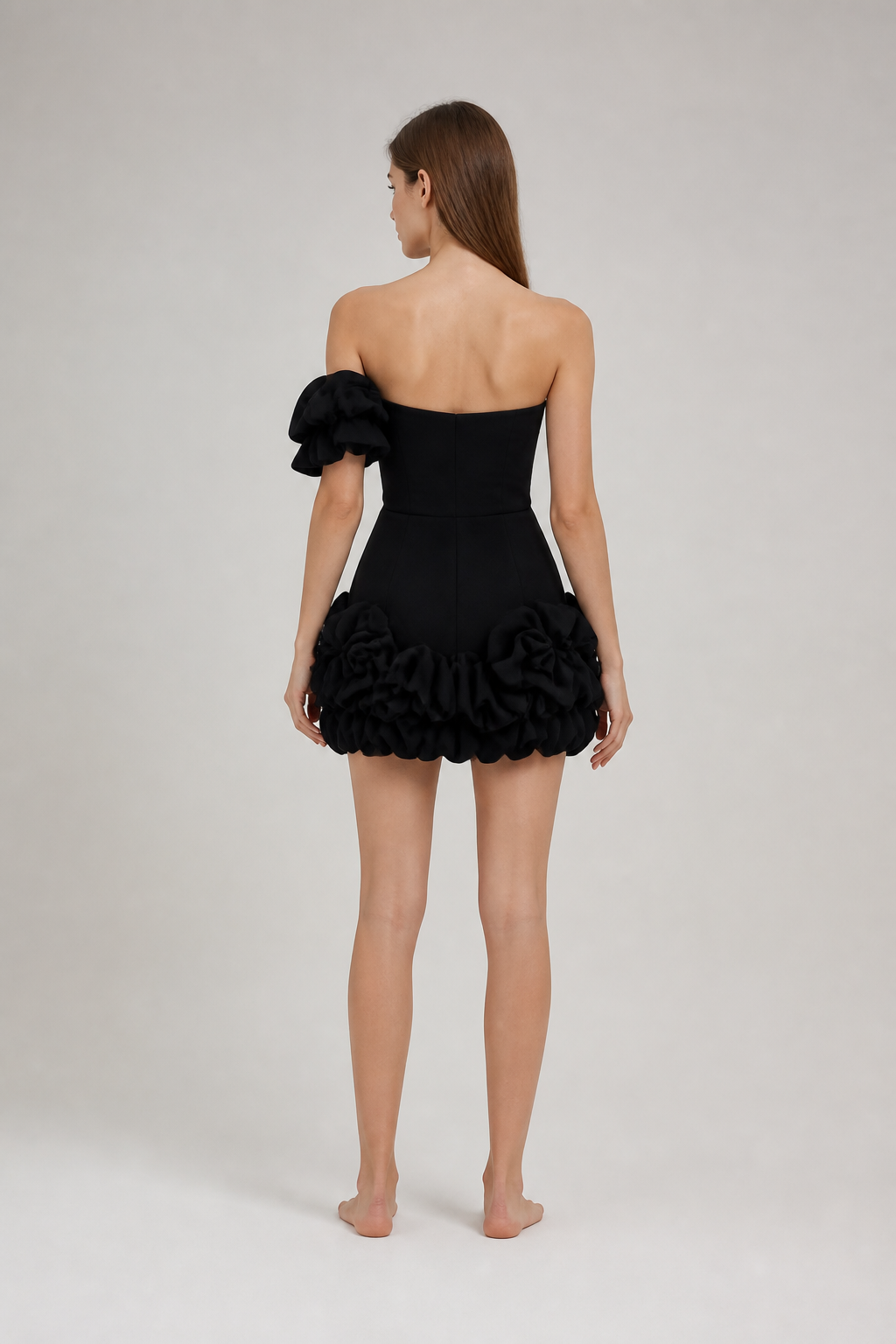 Short fitted black dress with ruffles back view