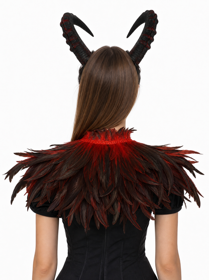 Back view of the black and red horned headpiece and layered feather collar worn over a black outfit