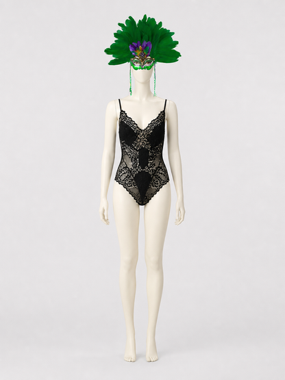 Full-body mannequin wearing the green feather mask with long side strands and a black lace bodysuit against a gray background
