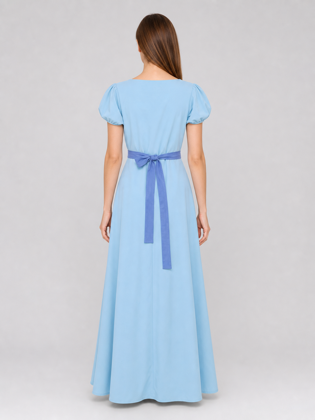 Peter Pan cosplay dress in light blue with contrasting purple-blue details. This style features a round neckline, short sleeves, and a long silhouette with a fitted upper body and a flared A-line skirt. The waist has contrasting ties that a