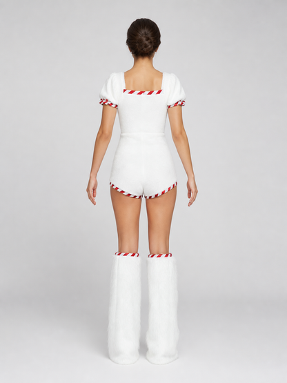 The Christmas Snowman costume is designed as a white snow character and includes a one-piece body with short sleeves and shorts, a white pointed hat, and white high leg gaiters. The design uses white, red, black, and orange colors. A red-an