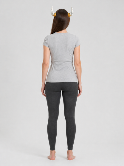White and amber horn headpiece shown from behind on a model wearing a gray shirt and dark leggings