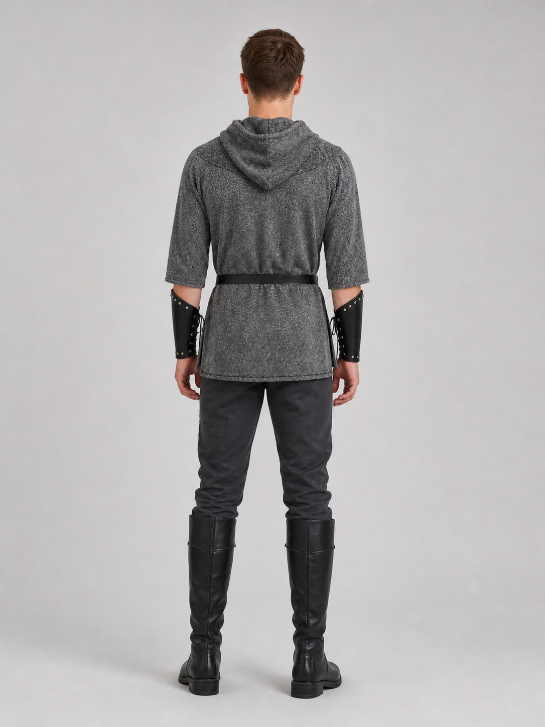 The costume is designed in the style of a medieval knight and is suitable for cosplay and stage performances. The set includes a gray hooded top with a layered front design, black pants, a belt, bracers, and greaves. The gray-and-black colo