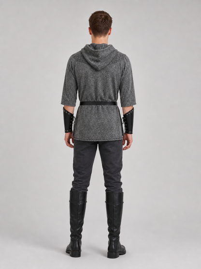 The costume is designed in the style of a medieval knight and is suitable for cosplay and stage performances. The set includes a gray hooded top with a layered front design, black pants, a belt, bracers, and greaves. The gray-and-black colo