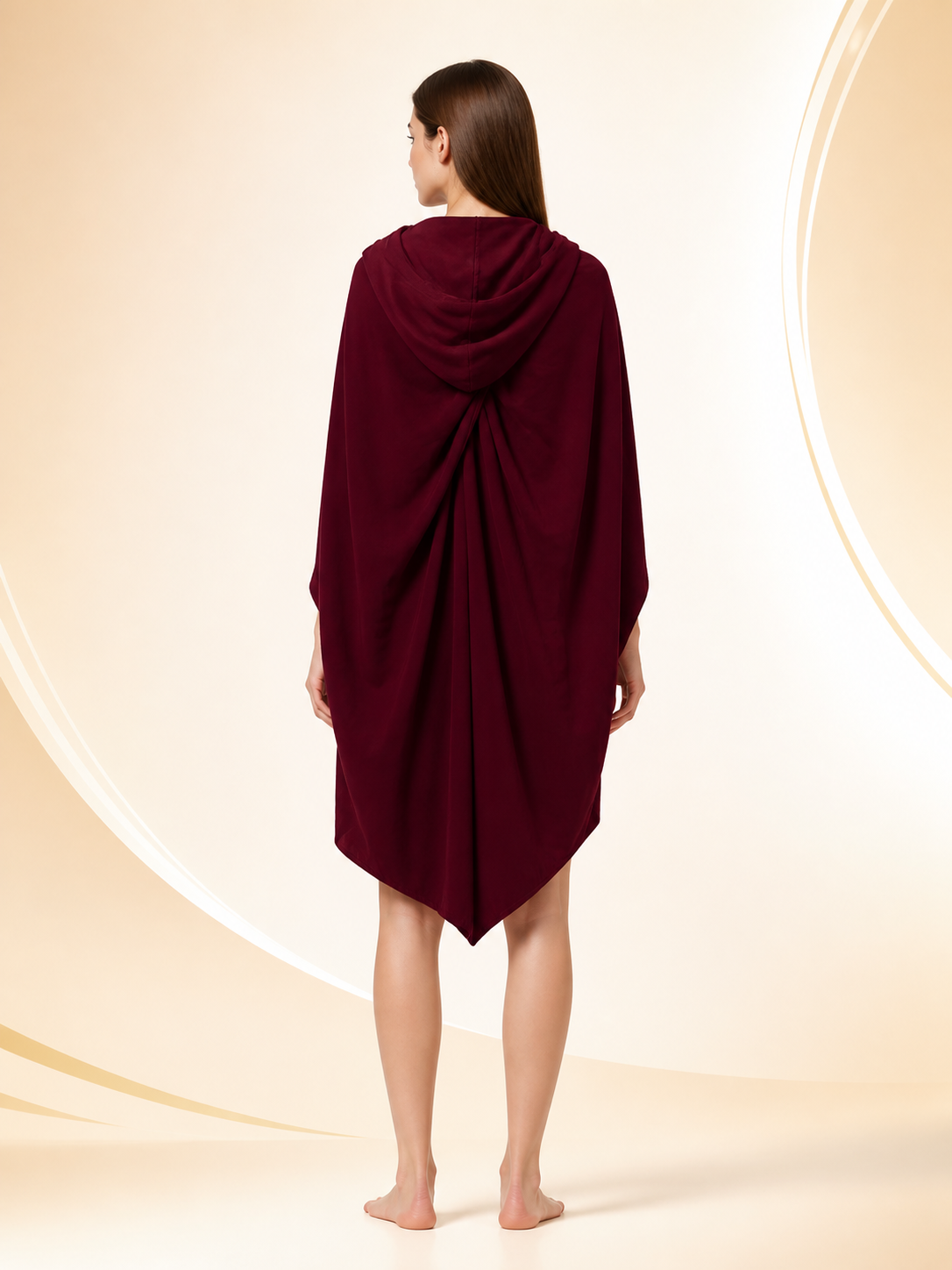 Back view of a burgundy hooded cloak on a woman, showing the draped hood and long pointed back hem