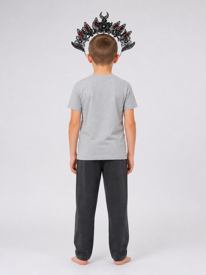 Black and silver-look horned headpiece with red stones and filigree details, shown from the back on a child wearing a gray shirt