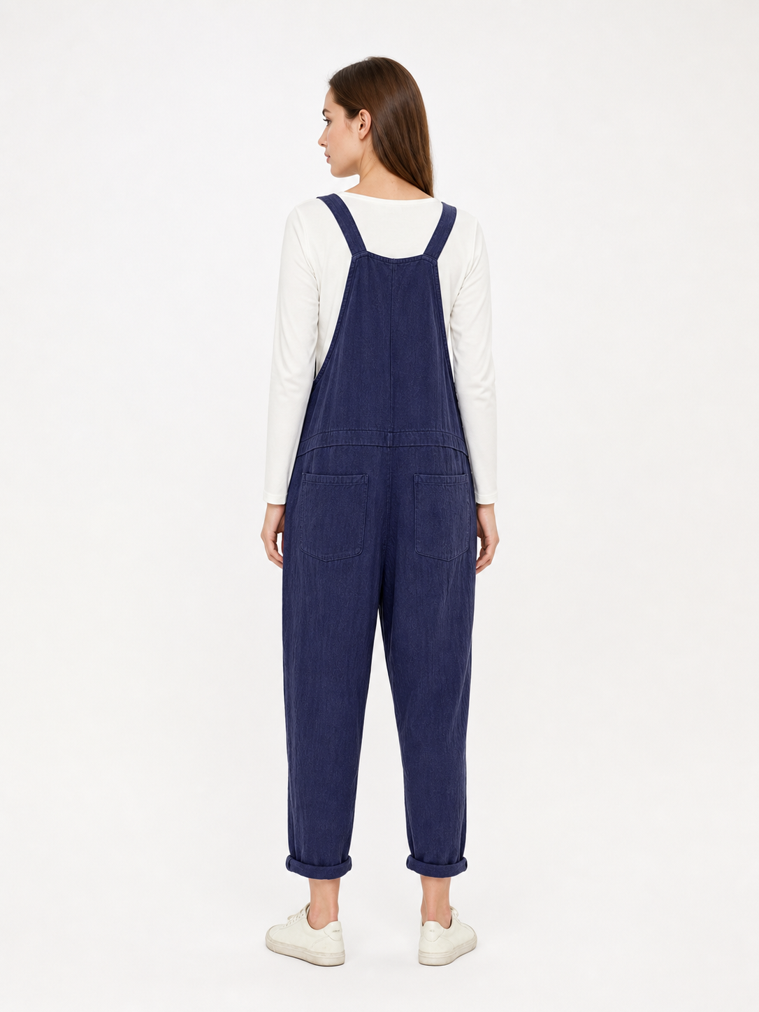 Loose-fit dark navy bib overalls with straps and pockets