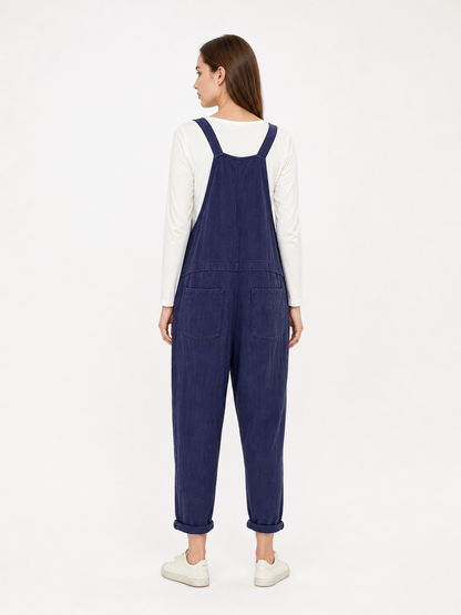 Loose-fit dark navy bib overalls with straps and pockets