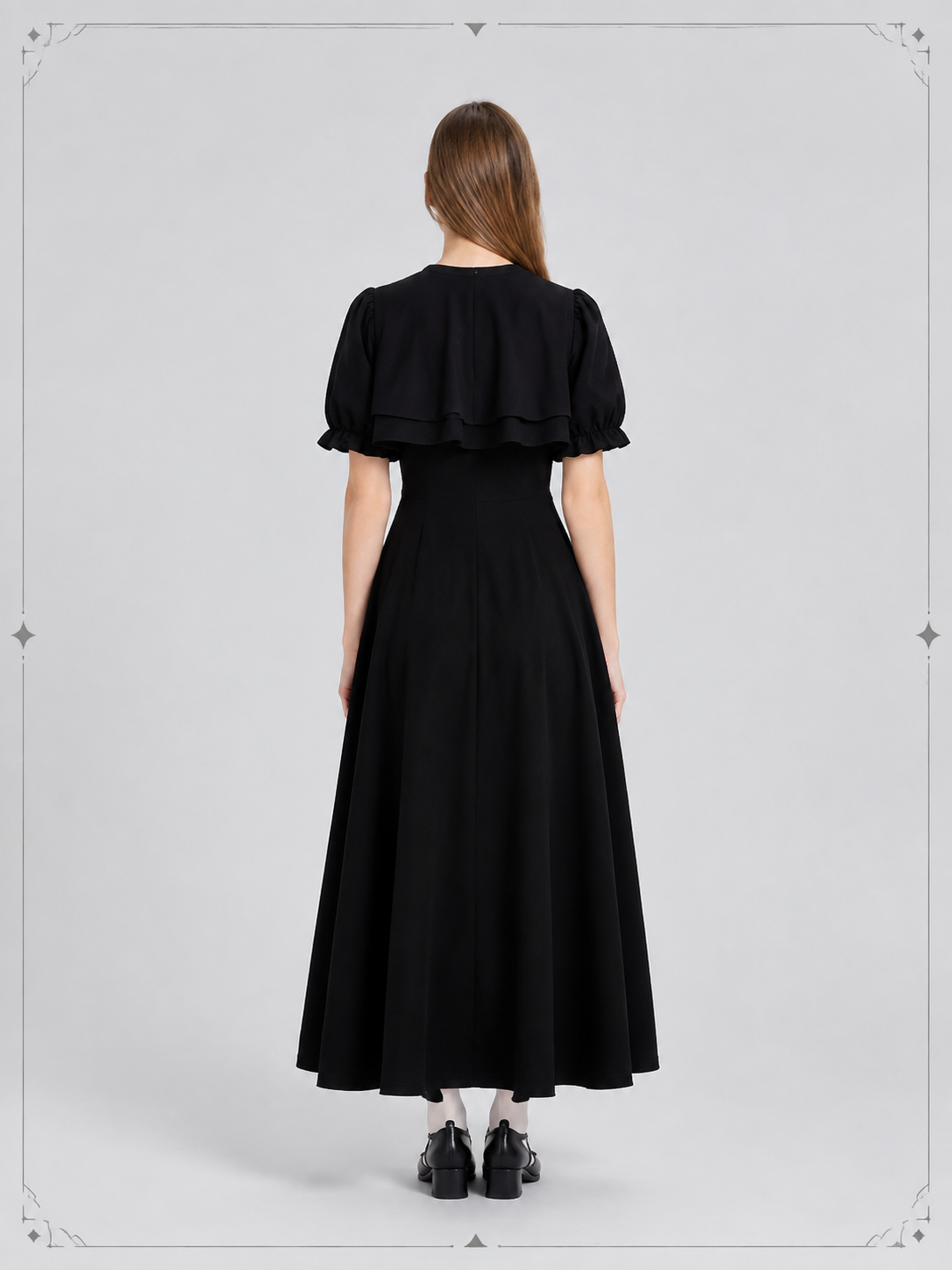 Black Retro-Style Dress with Cape and Bow back view