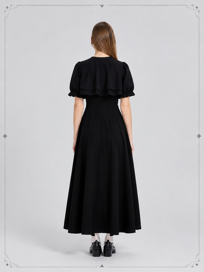 Black Retro-Style Dress with Cape and Bow back view