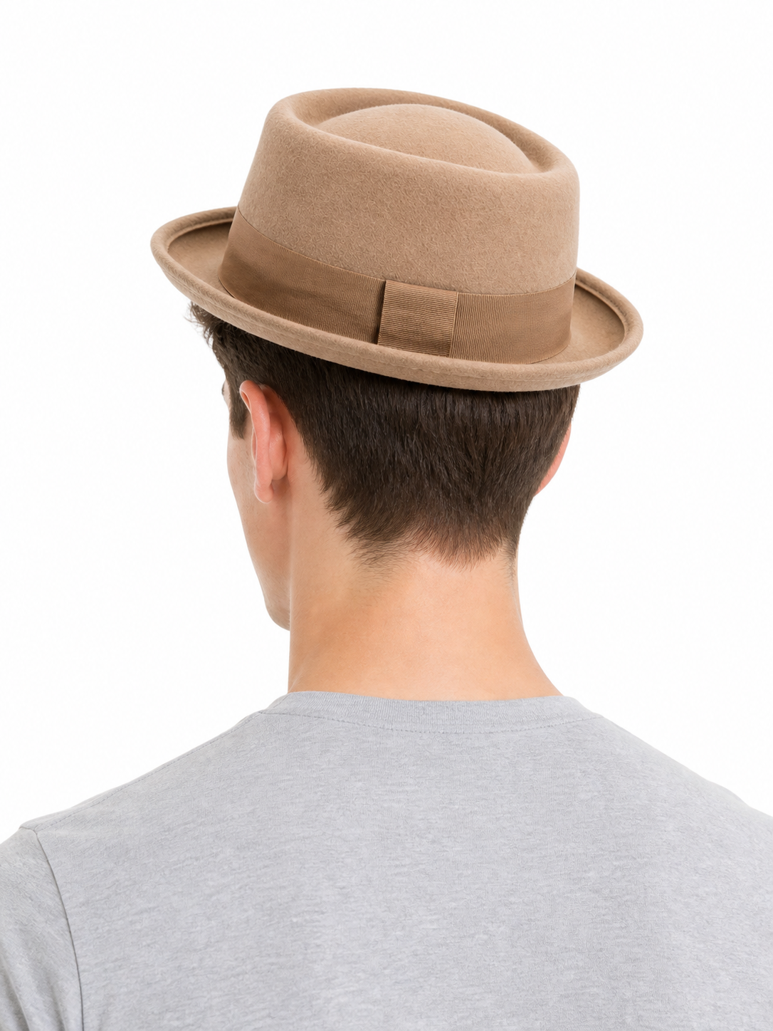Caramel-colored fedora hat suitable for everyday outfits, outdoor walks, themed events, and costume styling. The design features a classic fedora silhouette: a structured crown with a rounded top, a distinctive front indentation, and a wide