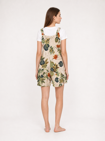 Back view of a beige floral romper layered over a white T-shirt, showing the floral print and square neckline