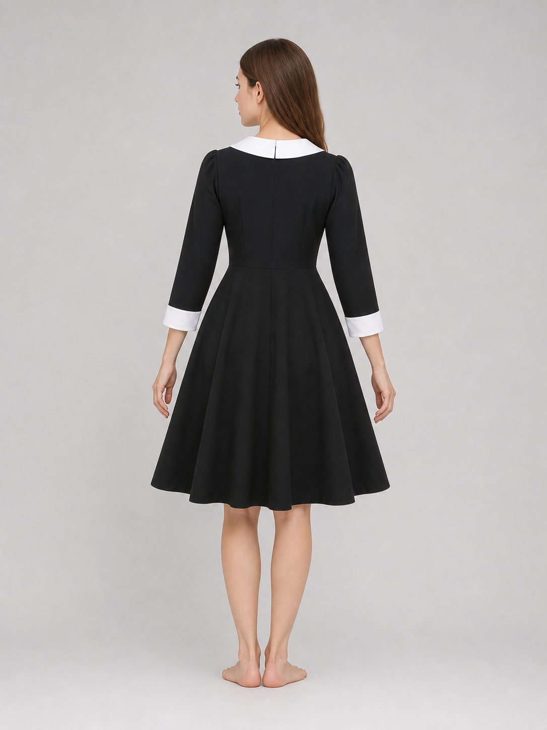 Black Wednesday-style dress with a white collar back view 2