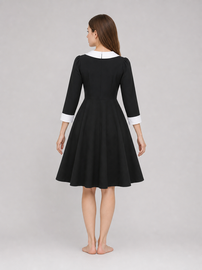 Black Wednesday-style dress with a white collar back view 2