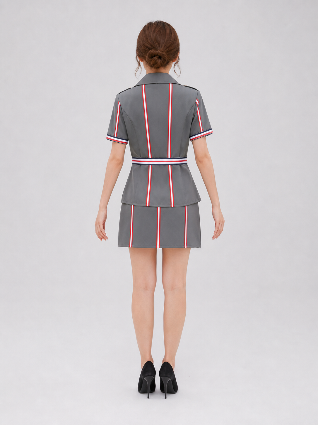 The set is designed in the style of a professional uniform and includes a short-sleeved top with a notched collar paired with a matching skirt. The design features gray, dark blue, red, gold, and black colors. The front of the top has red, 