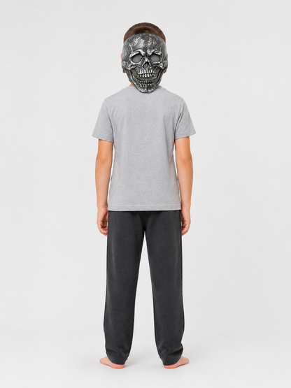 Black skull face mask with molded teeth and textured surface, shown on a full-body model viewed from the back