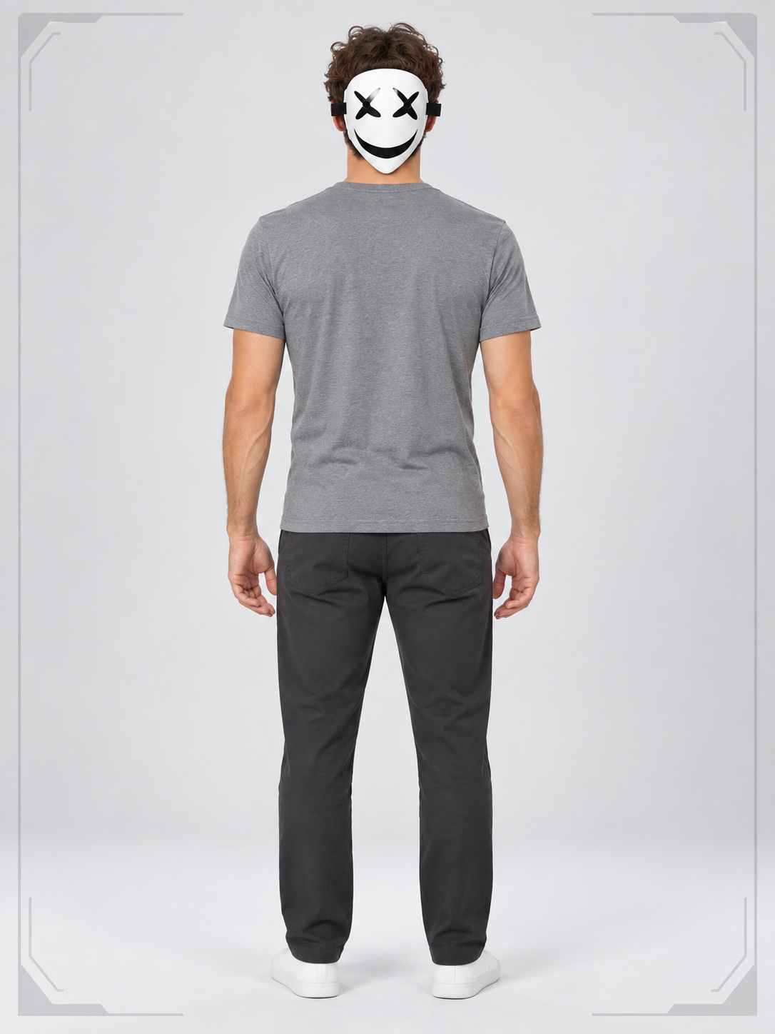 White mask with a black smile and cross-shaped eyes