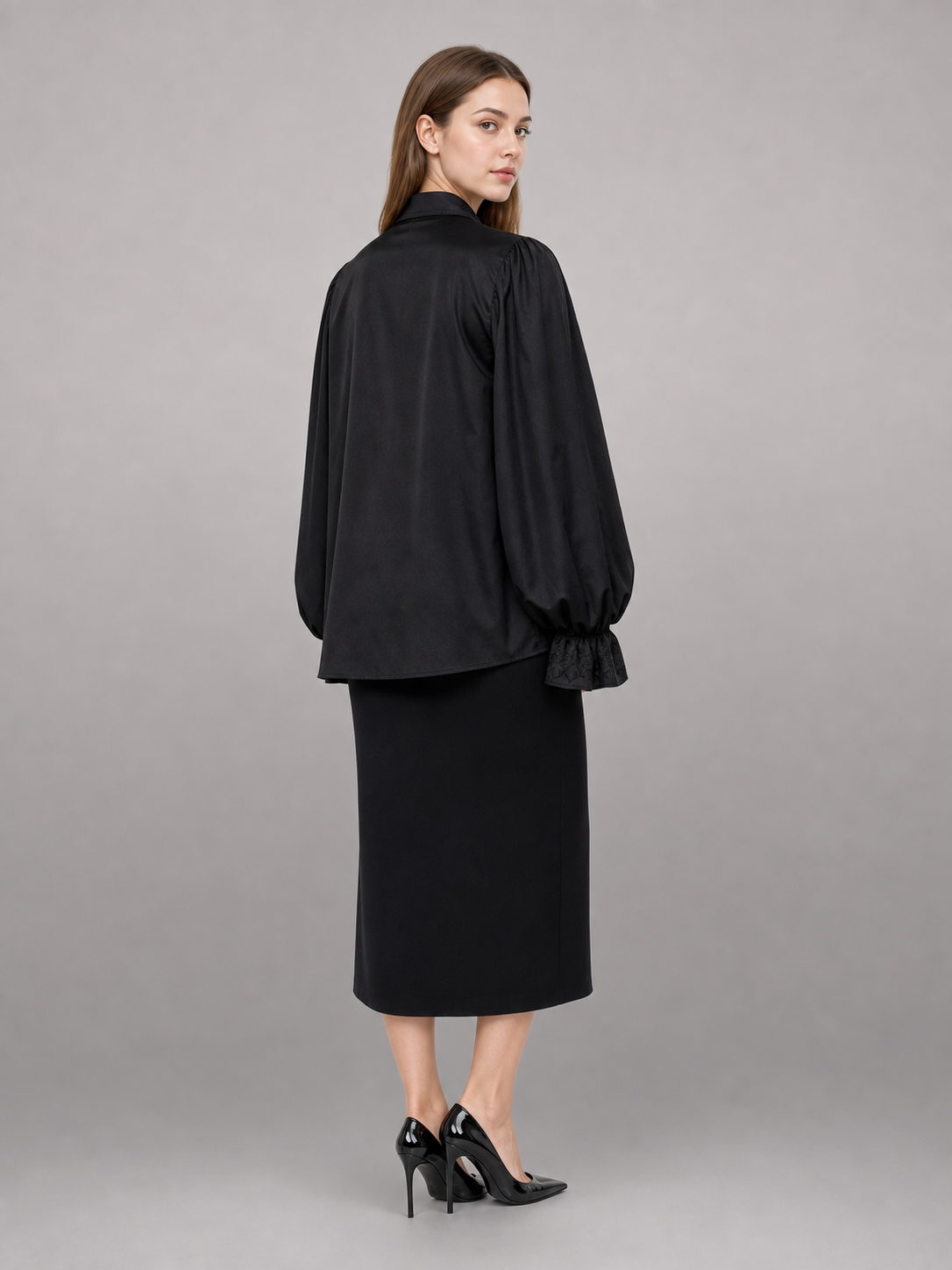 Black blouse with a high collar and ruffle