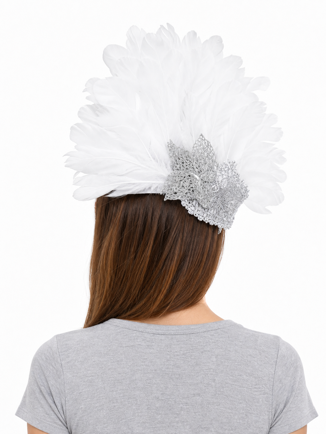 Back view of a white feather masquerade mask with silver detailing worn by a model with long brown hair