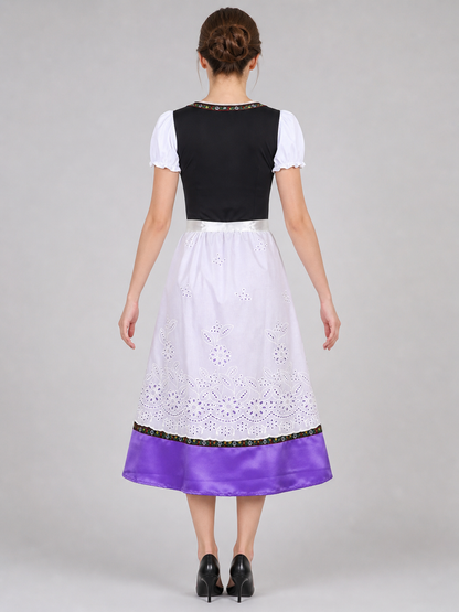 The dress is designed in an ethnic style and features a contrasting combination of white, pink, purple, and black. It has a black bodice, voluminous white puff sleeves, and a white waistband. The front is decorated with a purple lace-up det