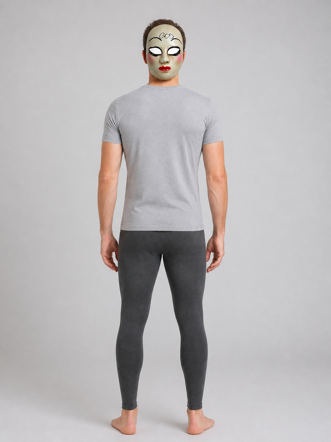 White theatrical mask shown on a full-body model, covering the face and featuring black eye details, pink cheeks, and red lips