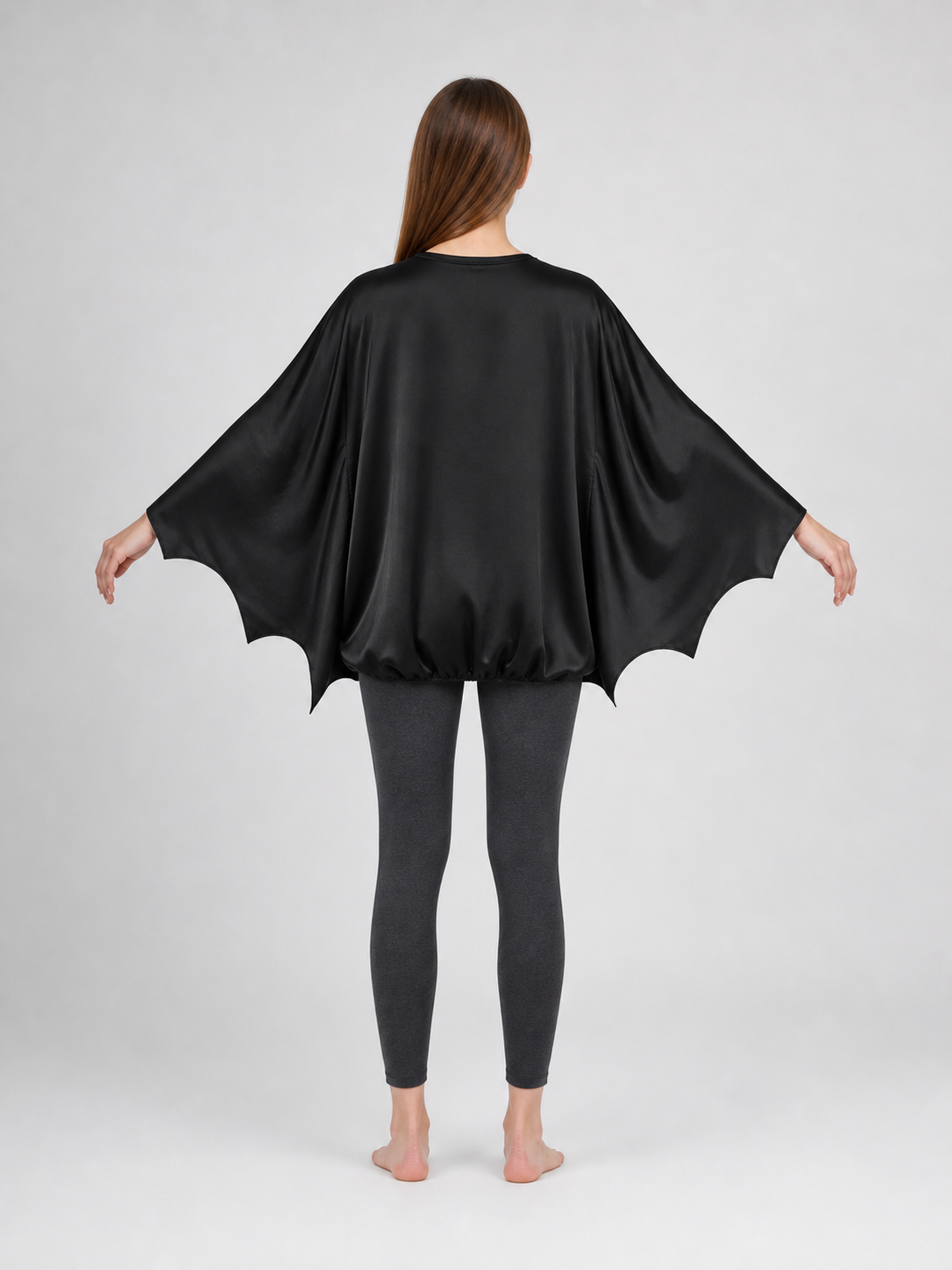 Black bat costume dress with a headband and ears for themed events. The design back view 2