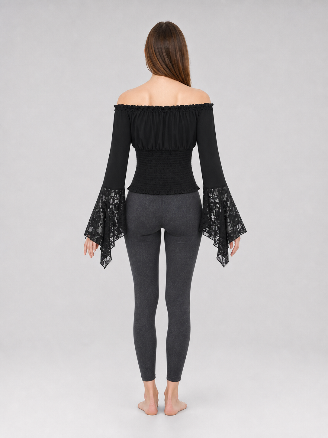 Black off-the-shoulder blouse with ruffles and long sleeves
