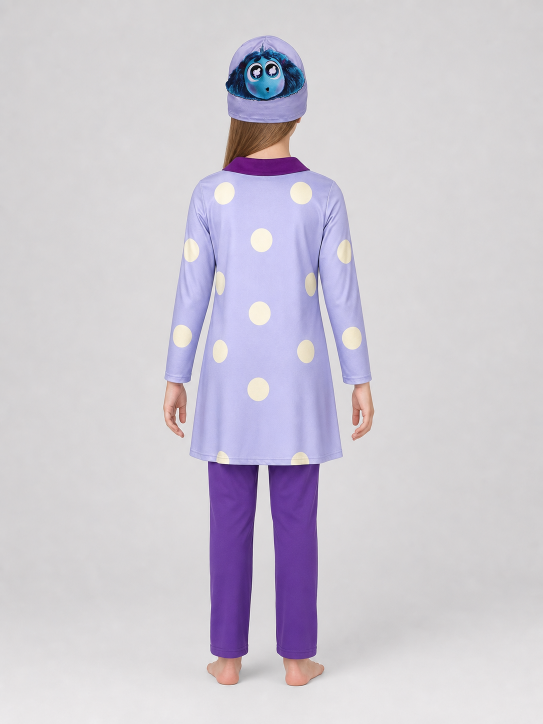 A bright costume set in the style of the character from Inside Out 2 is designed for a themed look and an eye-catching transformation. The set includes a long-sleeve tunic dress, matching leggings, and a headpiece with the character’s face 