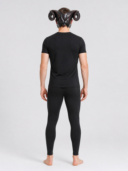 Full-body rear view of a man wearing the horned mask with curled ridged horns, a black shirt, and dark leggings