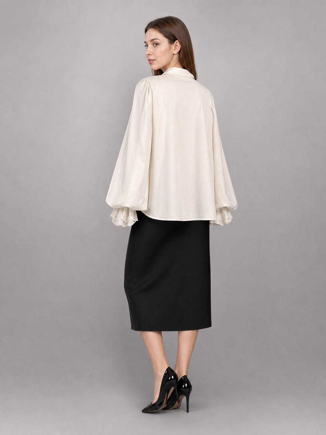White blouse with a high collar and ruffles