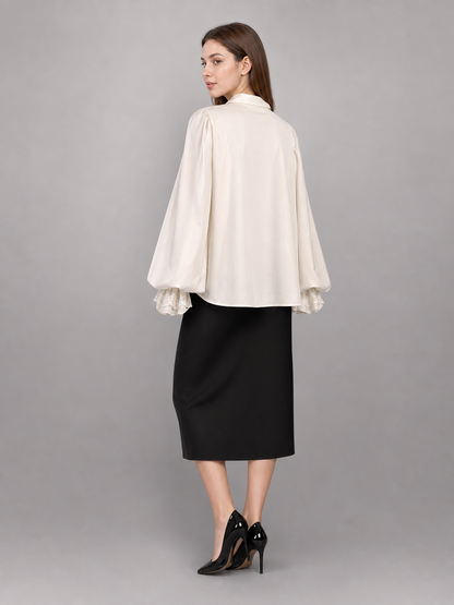 White blouse with a high collar and ruffles